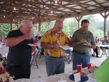 (Above) Judge Dill David Lee and Bob Connell Taste all of the pies