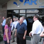 Folks talk after the ribbon cutting