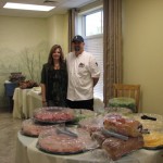 Pam Connell and the Chef from Indian Hills County Club take time out for a picture with all the food and decorations for the works of the Health Fair (Indian Hills Country Club the lunch sponsor)