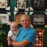 Janell takes time for a picture with her grand baby at Wallace Woodworks