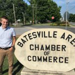 Kyle Christopher as the Director of Tourism